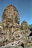 Angkor Thom - Bayon temple, second enclosure, corner towers seen from the central terrace 